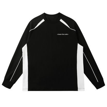 Black long-sleeve shirt with white accents and 'Pitch Born' logo on a white background