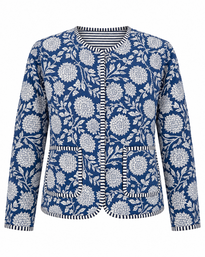 A women's long-sleeve jacket featuring a navy blue and white floral print, with striped trim along the collar, front placket, pockets, and cuffs.