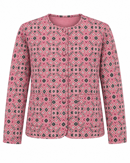 A pink long-sleeve quilted jacket with a geometric diamond pattern in black, white, and gray, featuring a button-up front and two front patch pockets.
