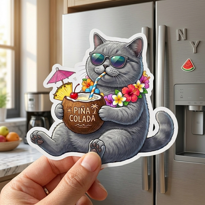 Sticker of a cat drinking a pina colada held in front of a refrigerator.