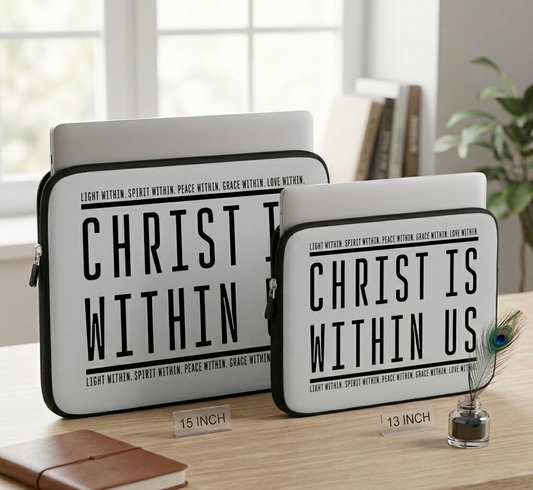 Two laptop sleeves with 'Christ is Within Us' text on a wooden surface.