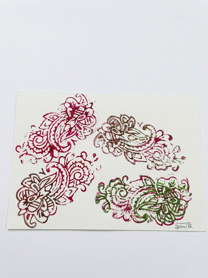 Four stylized floral designs in red, green, and white on a beige background.